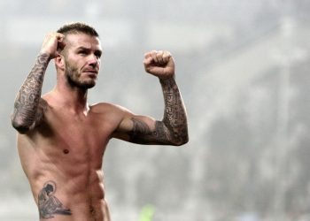 RNPS IMAGES OF THE YEAR 2010 - AC Milan David Beckham celebrates at the end of the match against Juventus during their Serie A soccer match at Olympic stadium in Turin, January 10, 2010. AC Milan won 3-0.       REUTERS/Stefano Rellandini (ITALY - Tags: SPORT SOCCER IMAGES OF THE DAY)