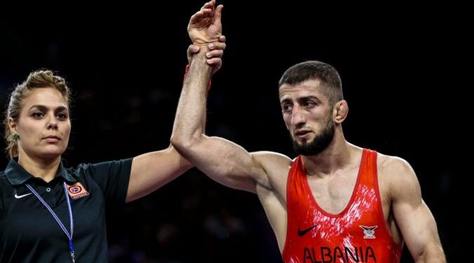 Islam Dudaev of Albania (Red) v Baku Akazawa of Samoa (Blue) during the Olympic Games mens 100m relay final at the Stade de France in Paris, France on the August 10, 2024 ©Barry Aldworth/BackpagePix