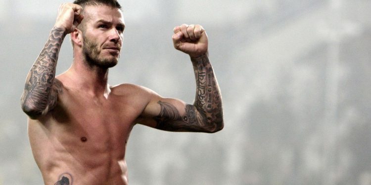 RNPS IMAGES OF THE YEAR 2010 - AC Milan David Beckham celebrates at the end of the match against Juventus during their Serie A soccer match at Olympic stadium in Turin, January 10, 2010. AC Milan won 3-0.       REUTERS/Stefano Rellandini (ITALY - Tags: SPORT SOCCER IMAGES OF THE DAY)